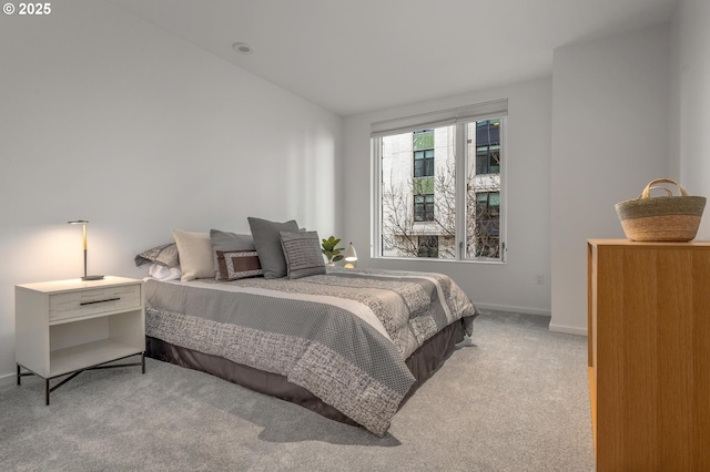 carpeted bedroom featuring baseboards