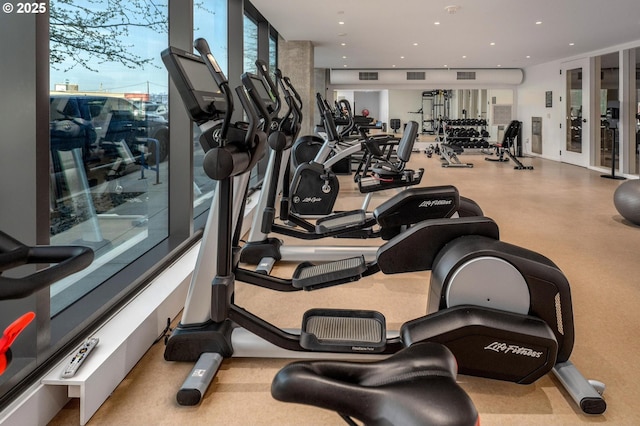 exercise room featuring recessed lighting and visible vents