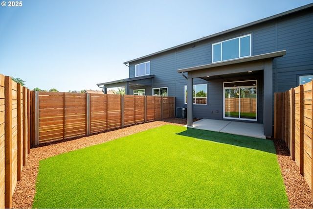 619 E Heintz St, Molalla, OR 97038 - rear view of house with a patio area and a fenced backyard