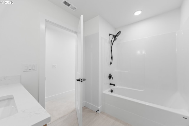 619 E Heintz St, Molalla, OR 97038 - bathroom with shower / bathtub combination, vanity, wood finished floors, and recessed lighting