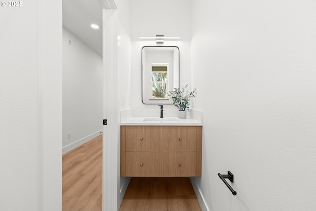 619 E Heintz St, Molalla, OR 97038 - bathroom with vanity, wood finished floors, and recessed lighting