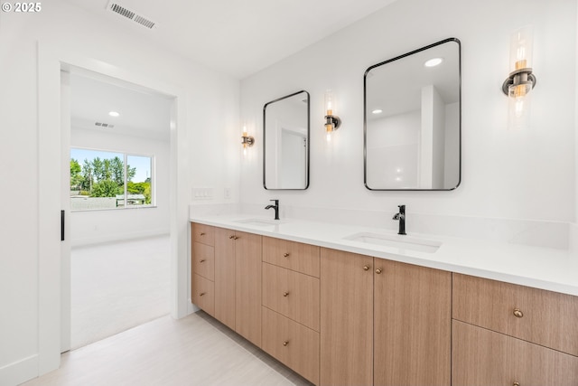 619 E Heintz St, Molalla, OR 97038 - full bath featuring double vanity, wood finished floors, and recessed lighting