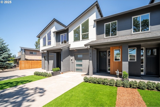 619 E Heintz St, Molalla, OR 97038 - contemporary home featuring driveway, a porch, and a garage