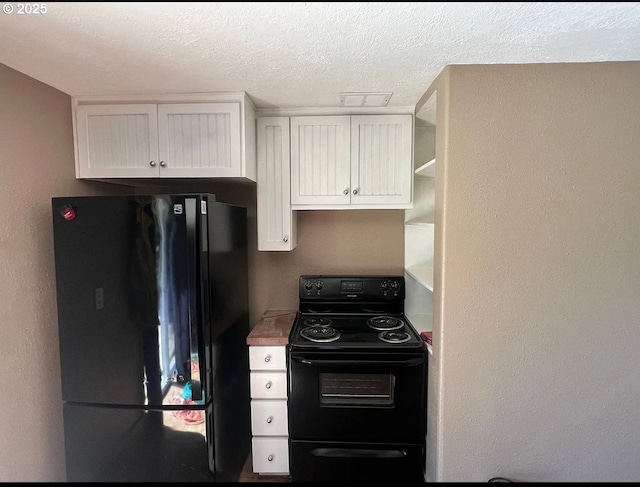 kitchen with black appliances, white cabinets, a textured ceiling, light countertops, and open shelves