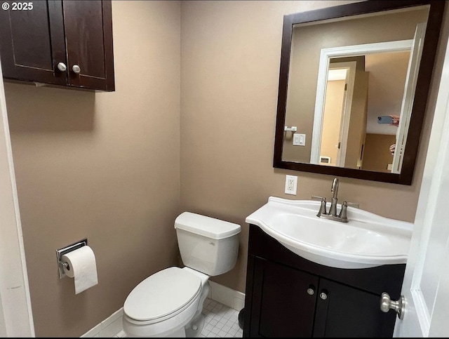 bathroom with tile patterned floors, vanity, and toilet