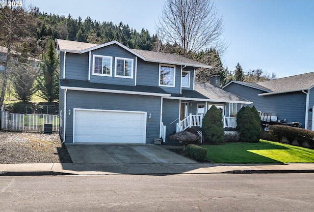 traditional-style house featuring fence, covered porch, concrete driveway, a front yard, and a garage