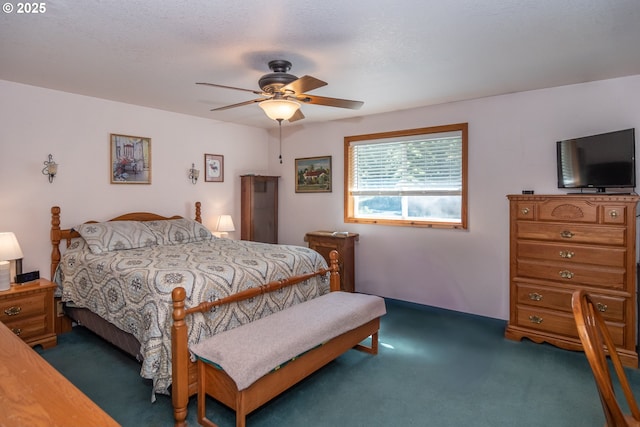 bedroom with dark colored carpet and ceiling fan