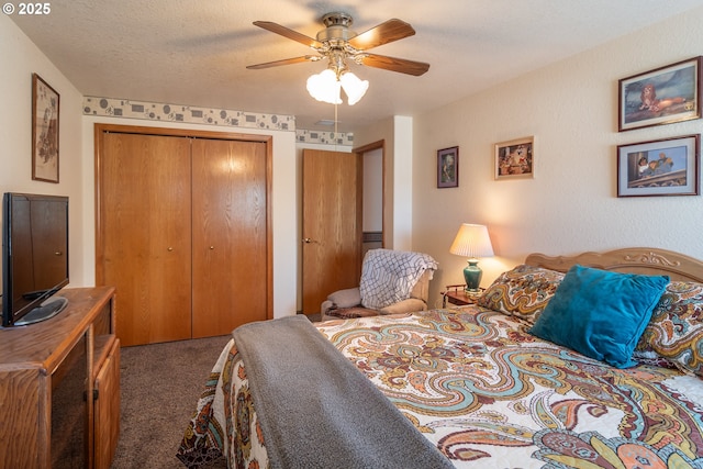 carpeted bedroom with a closet, a textured ceiling, and ceiling fan