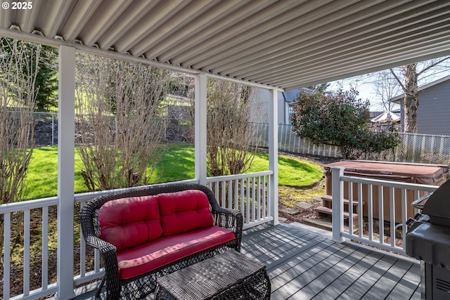 wooden terrace featuring a fenced backyard