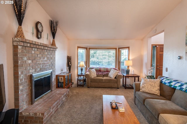 living area featuring carpet flooring, a fireplace, and lofted ceiling