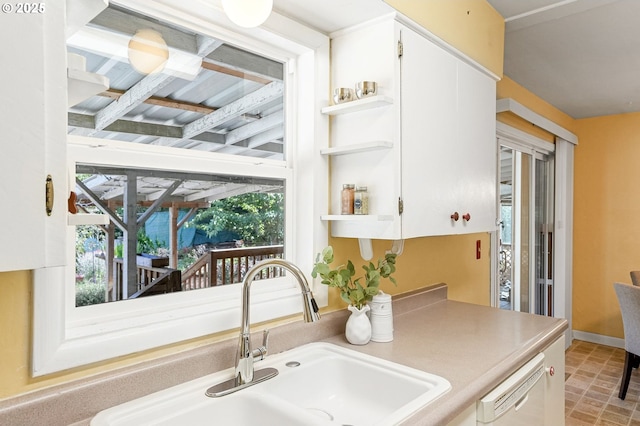 1052 Shamrock Dr SE, Salem, OR 97302 - kitchen with white cabinets, dishwasher, open shelves, and light countertops