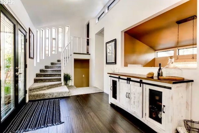 3484634844 Matthews Rd, Eugene, OR 97405 - bar featuring healthy amount of natural light, dark wood-style flooring, and stairway