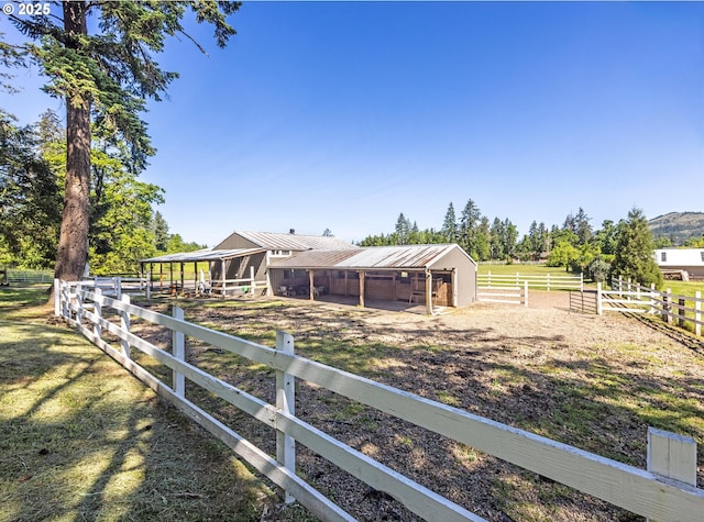3484634844 Matthews Rd, Eugene, OR 97405 - view of yard featuring an exterior structure, an outdoor structure, and a view of countryside
