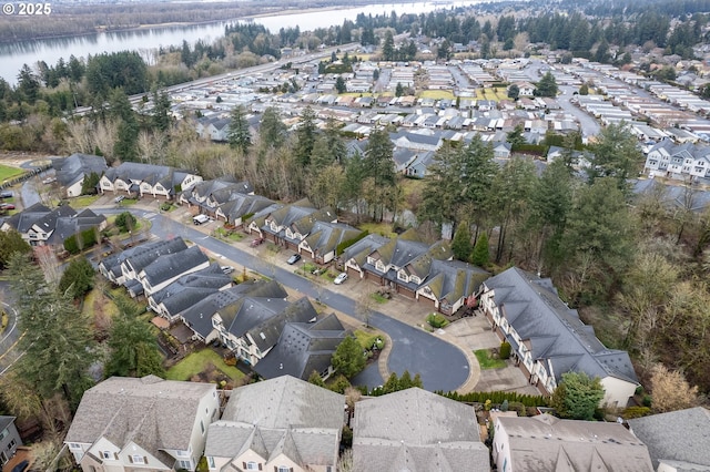 drone / aerial view with a residential view and a water view