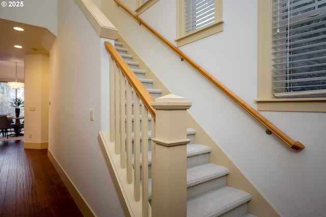 stairway with wood-type flooring, recessed lighting, and baseboards