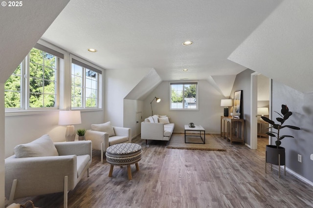 3840 NW Loy Ct, Portland, OR 97229 - sitting room with wood finished floors, a textured ceiling, recessed lighting, and lofted ceiling
