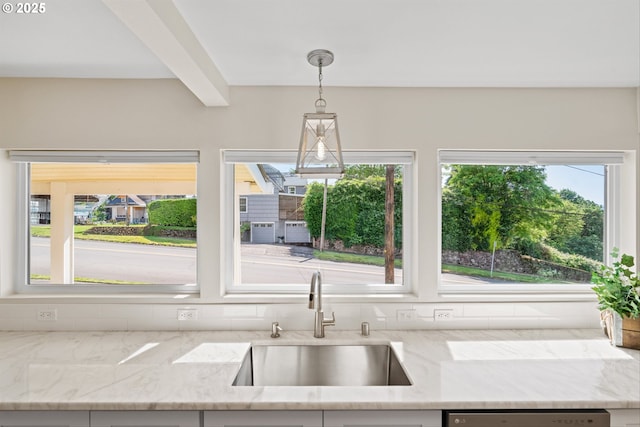 1331 NE Dallas St, Camas, WA 98607 - kitchen with a sink, stainless steel dishwasher, light stone countertops, and pendant lighting