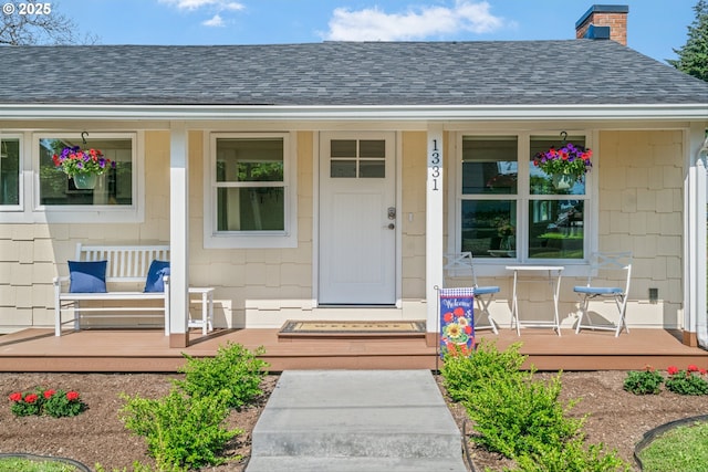 1331 NE Dallas St, Camas, WA 98607 - view of exterior entry featuring a porch, roof with shingles, and a chimney