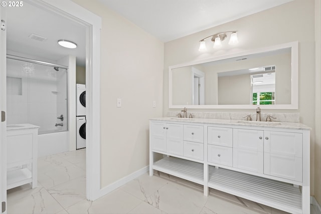 1331 NE Dallas St, Camas, WA 98607 - full bath with marble look tiles, stacked washing machine and dryer, double vanity, and baseboards