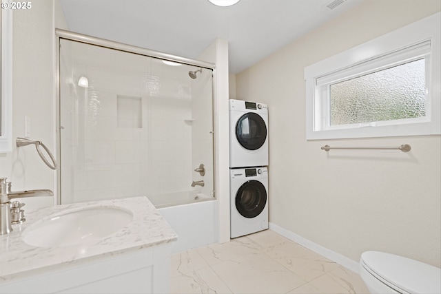 1331 NE Dallas St, Camas, WA 98607 - full bathroom with stacked washer and clothes dryer, toilet, vanity, marble finish floors, and shower / tub combination