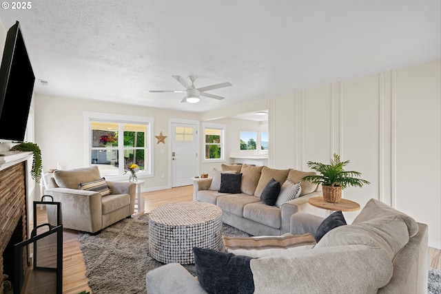 1331 NE Dallas St, Camas, WA 98607 - living room with light wood finished floors, a ceiling fan, and plenty of natural light