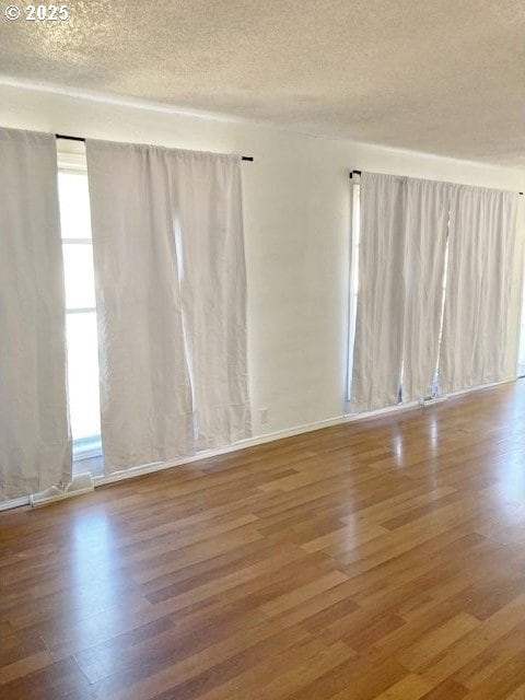 727 SW 28th St, Pendleton, OR 97801 - empty room with wood finished floors and a textured ceiling