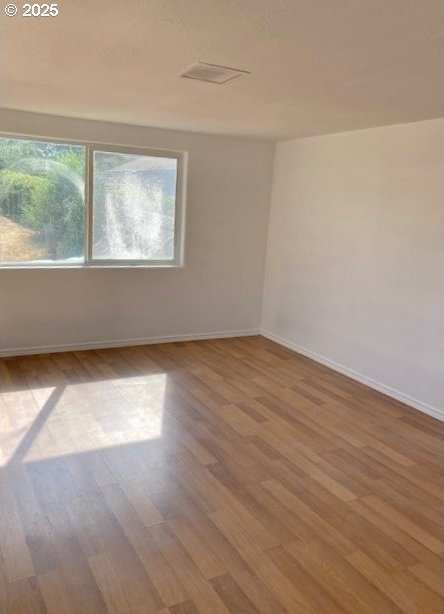 727 SW 28th St, Pendleton, OR 97801 - unfurnished room featuring wood finished floors and baseboards