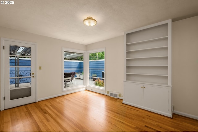 1134 NE Cesar E Chavez Blvd, Portland, OR 97232 - unfurnished dining area with light wood-type flooring