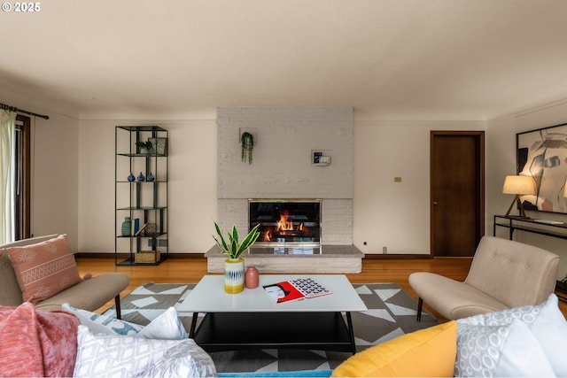 1134 NE Cesar E Chavez Blvd, Portland, OR 97232 - living room featuring light wood-style floors and a brick fireplace