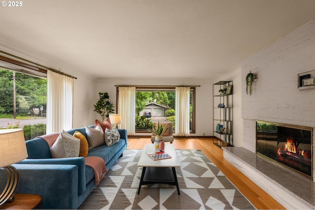 1134 NE Cesar E Chavez Blvd, Portland, OR 97232 - living area with a high end fireplace and wood finished floors