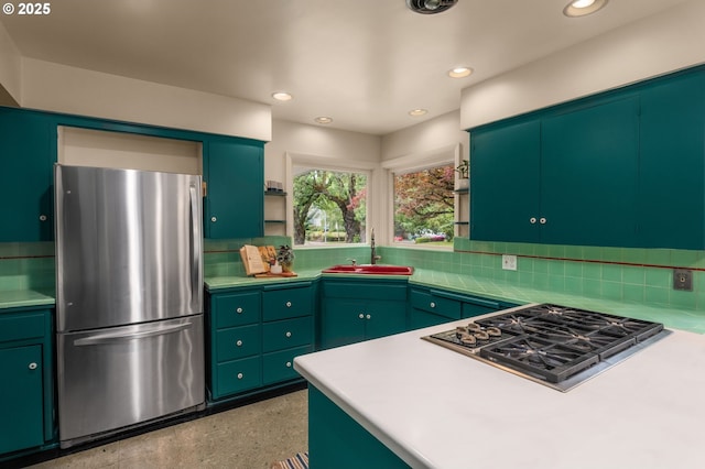 1134 NE Cesar E Chavez Blvd, Portland, OR 97232 - kitchen featuring stainless steel appliances, backsplash, open shelves, recessed lighting, and light countertops