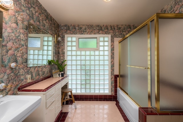 1134 NE Cesar E Chavez Blvd, Portland, OR 97232 - full bath with wallpapered walls, tile patterned floors, and shower / bath combination with glass door