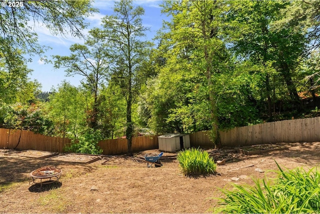 5944 SW Wilbard St, Portland, OR 97219 - fenced backyard featuring a fire pit