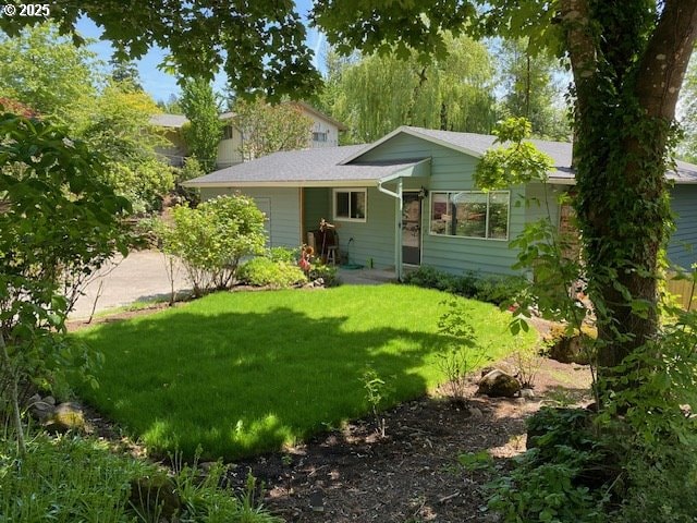 5944 SW Wilbard St, Portland, OR 97219 - back of house featuring a yard and driveway