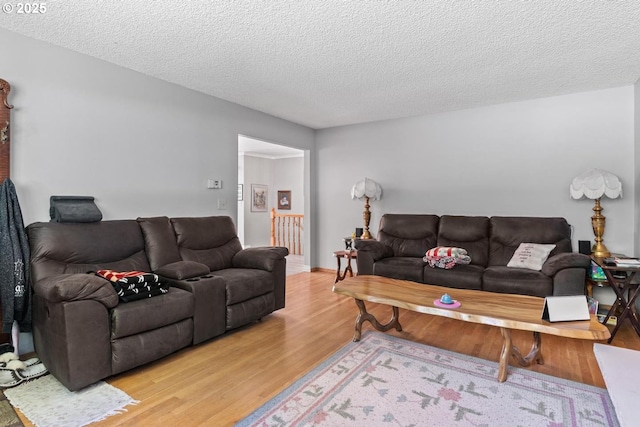 5944 SW Wilbard St, Portland, OR 97219 - living area with light wood-style flooring and a textured ceiling