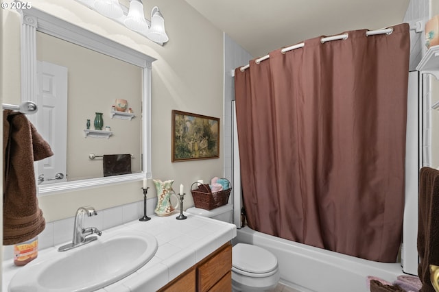 bathroom featuring shower / bath combo, toilet, and vanity