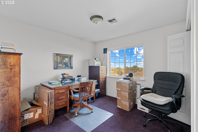 office with dark colored carpet and visible vents