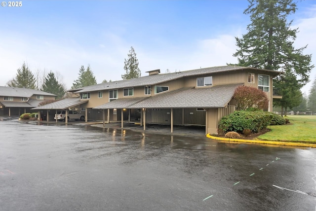 view of front of property featuring a carport