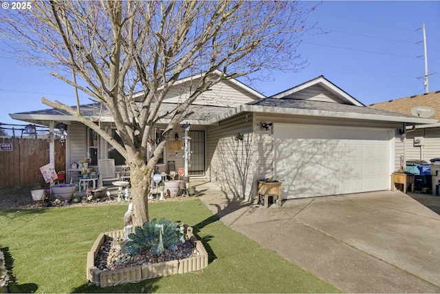 exterior space featuring a yard, driveway, an attached garage, and fence