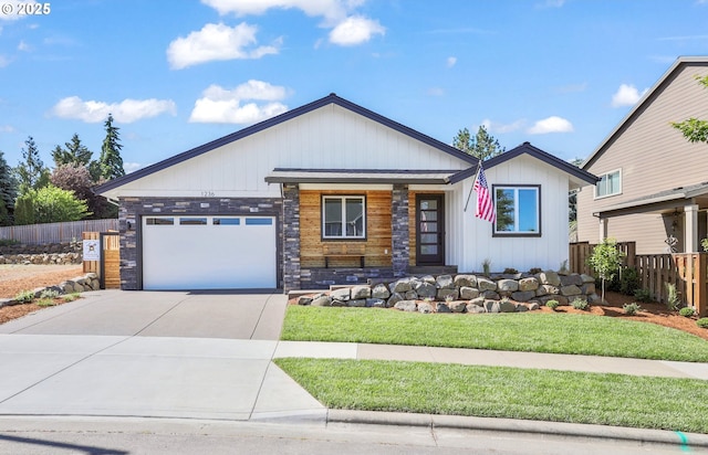1236 Parkside Ave, Forest Grove, OR 97116 - view of front of house with driveway, a garage, covered porch, and stone siding