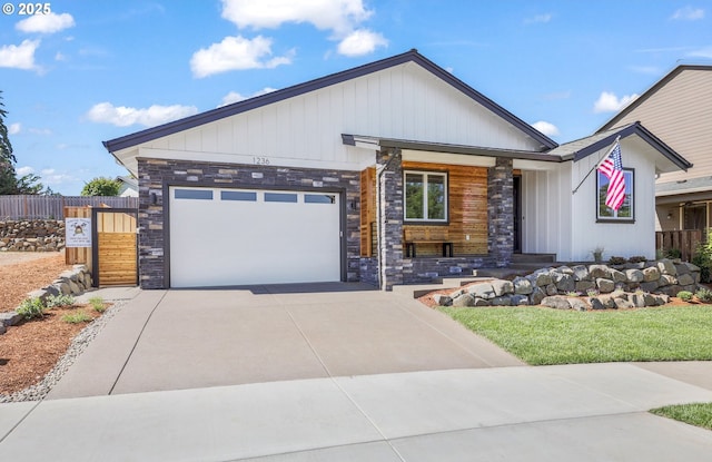 1236 Parkside Ave, Forest Grove, OR 97116 - view of front of home featuring stone siding, driveway, and an attached garage