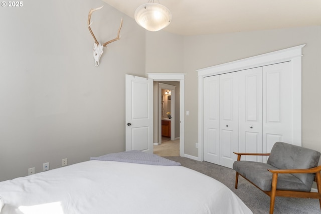 4952 SW Wentworth Ter, Beaverton, OR 97078 - carpeted bedroom featuring a closet, baseboards, and high vaulted ceiling