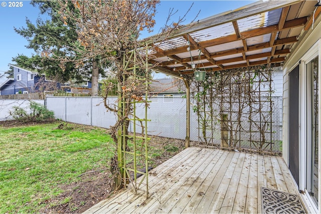 deck with a pergola and a lawn