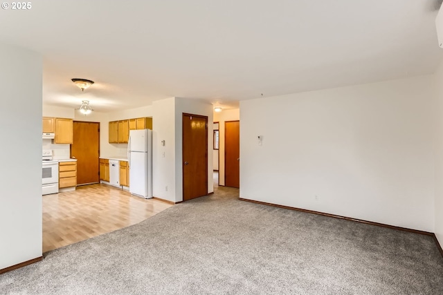 unfurnished living room featuring light colored carpet