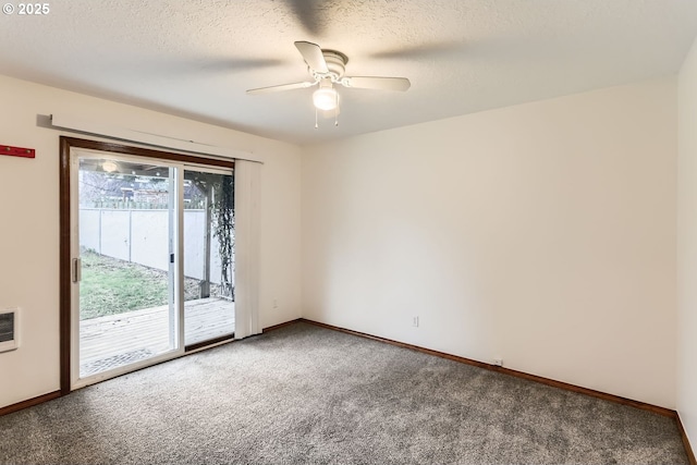 empty room with a textured ceiling, ceiling fan, and carpet flooring