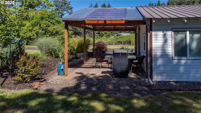 view of patio featuring a gazebo and a grill
