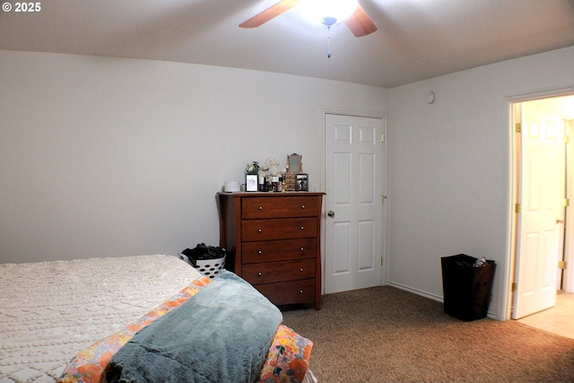 bedroom featuring light carpet and ceiling fan