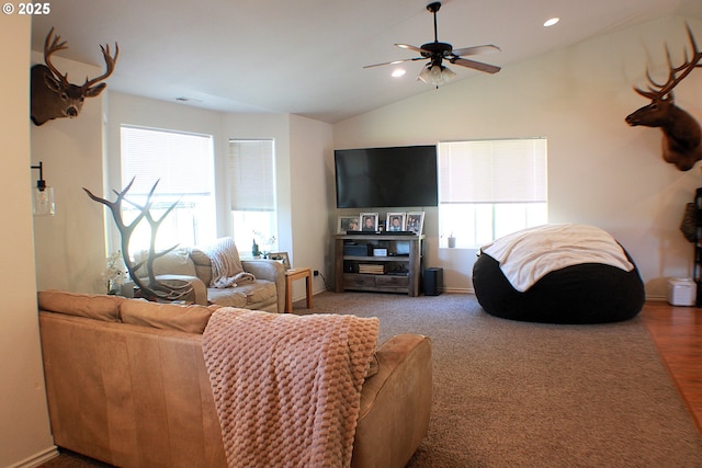 living room with a ceiling fan, wood finished floors, baseboards, lofted ceiling, and recessed lighting