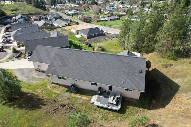 birds eye view of property with a residential view