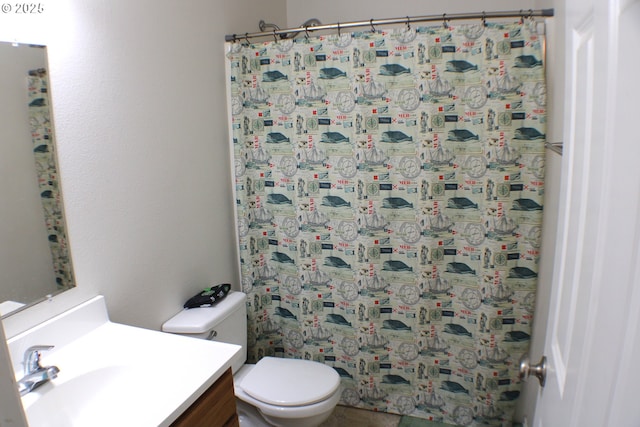 bathroom with toilet and vanity
